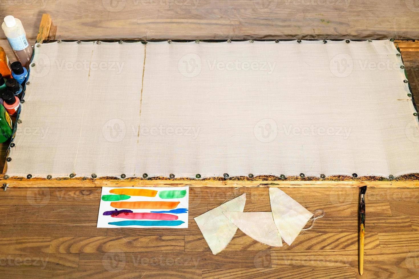 blank fabric attached to wooden frame for batik photo