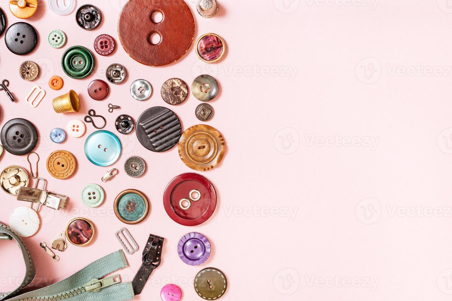 many sewing objects on pink with blank copyspace photo