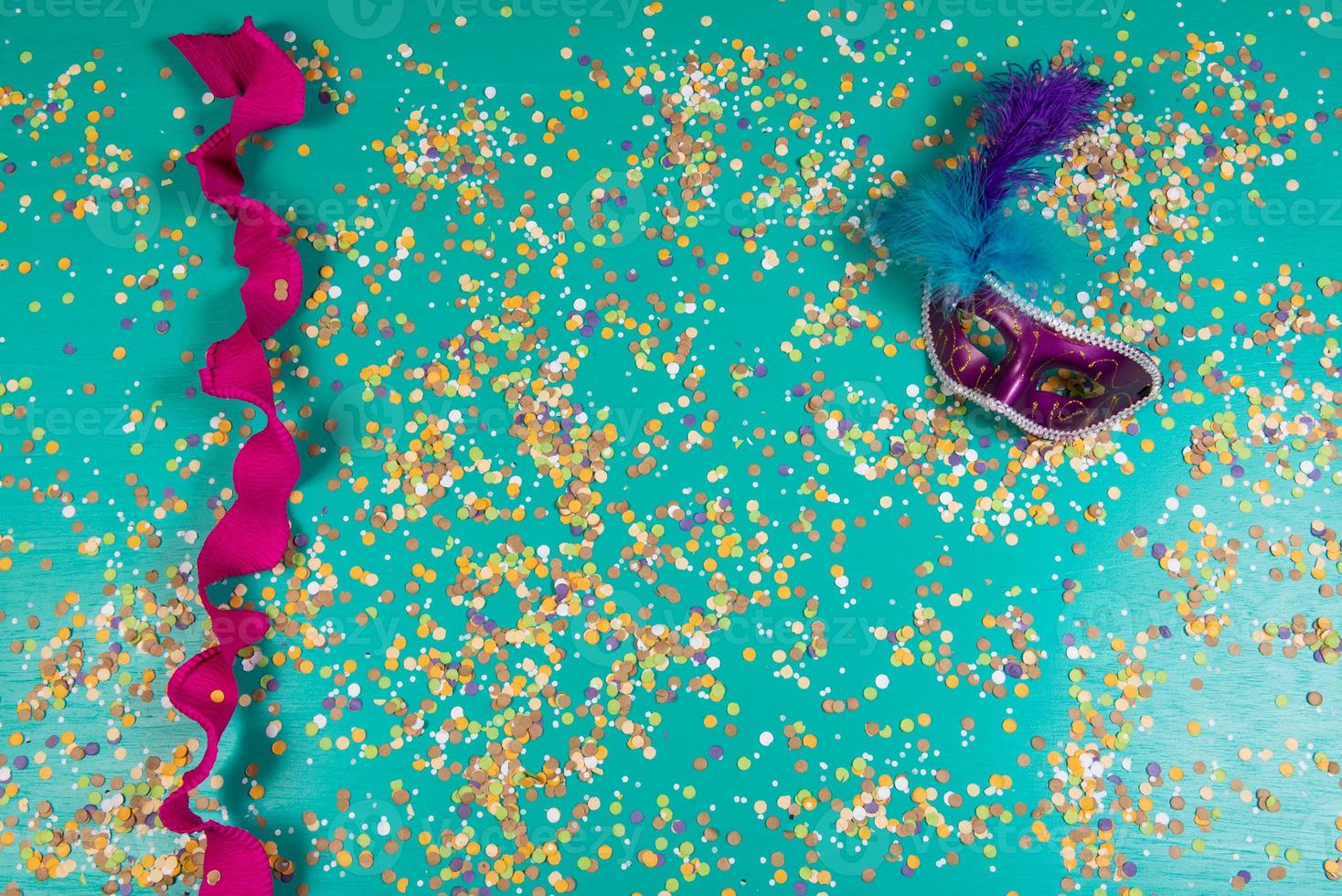 Background of confetti with elements related to the carnival and summer photo