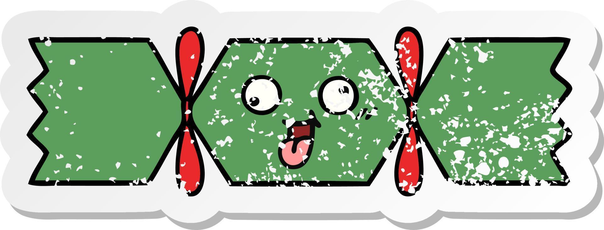 distressed sticker of a cute cartoon christmas cracker vector