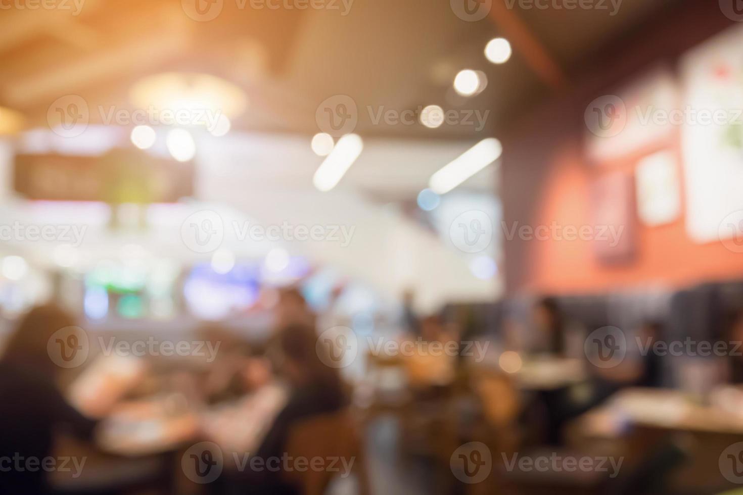 People in restaurant cafe interior with bokeh light blurred customer abstract background photo