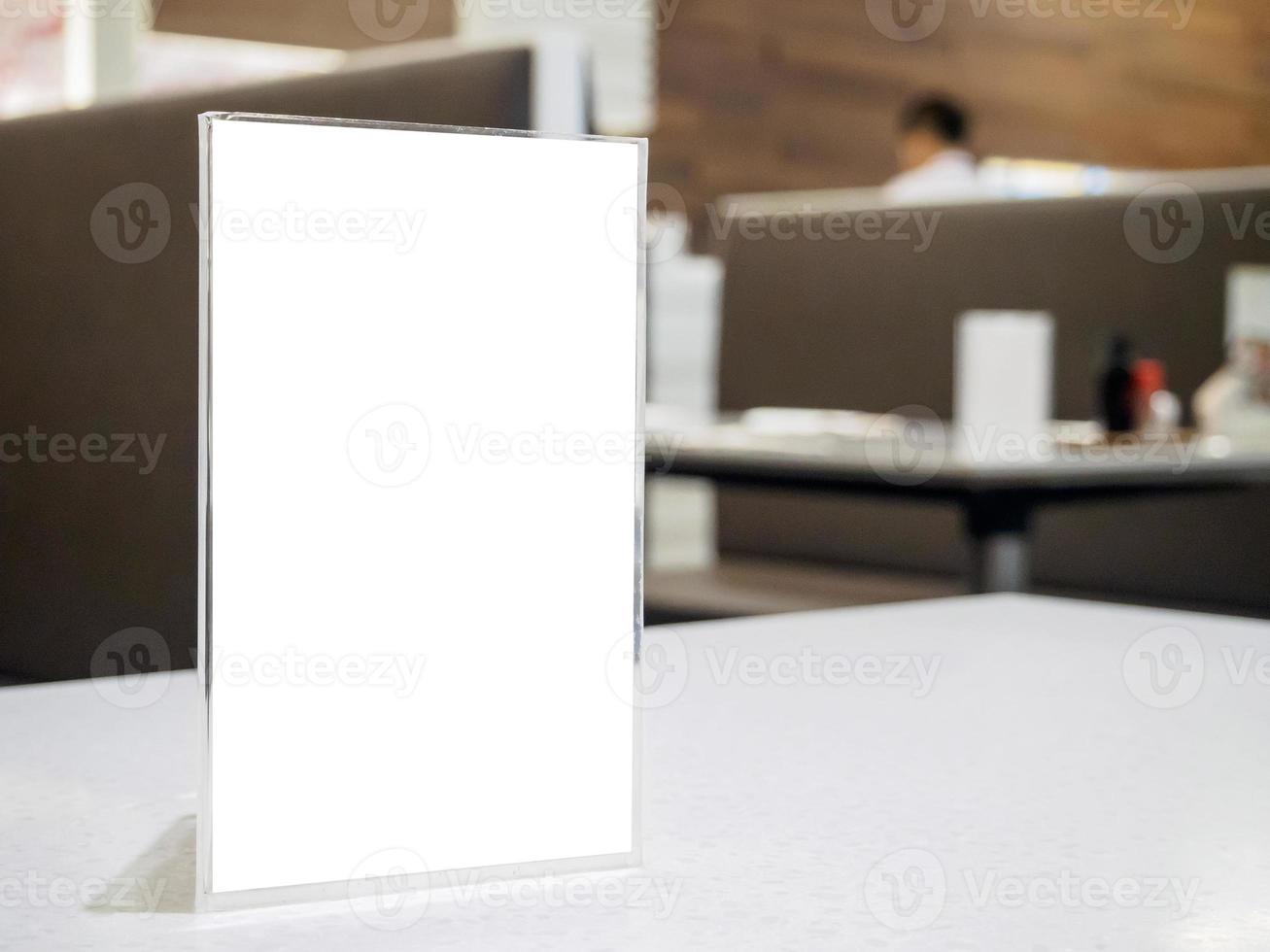 Mock up menu frame on table in the cafe restaurant photo