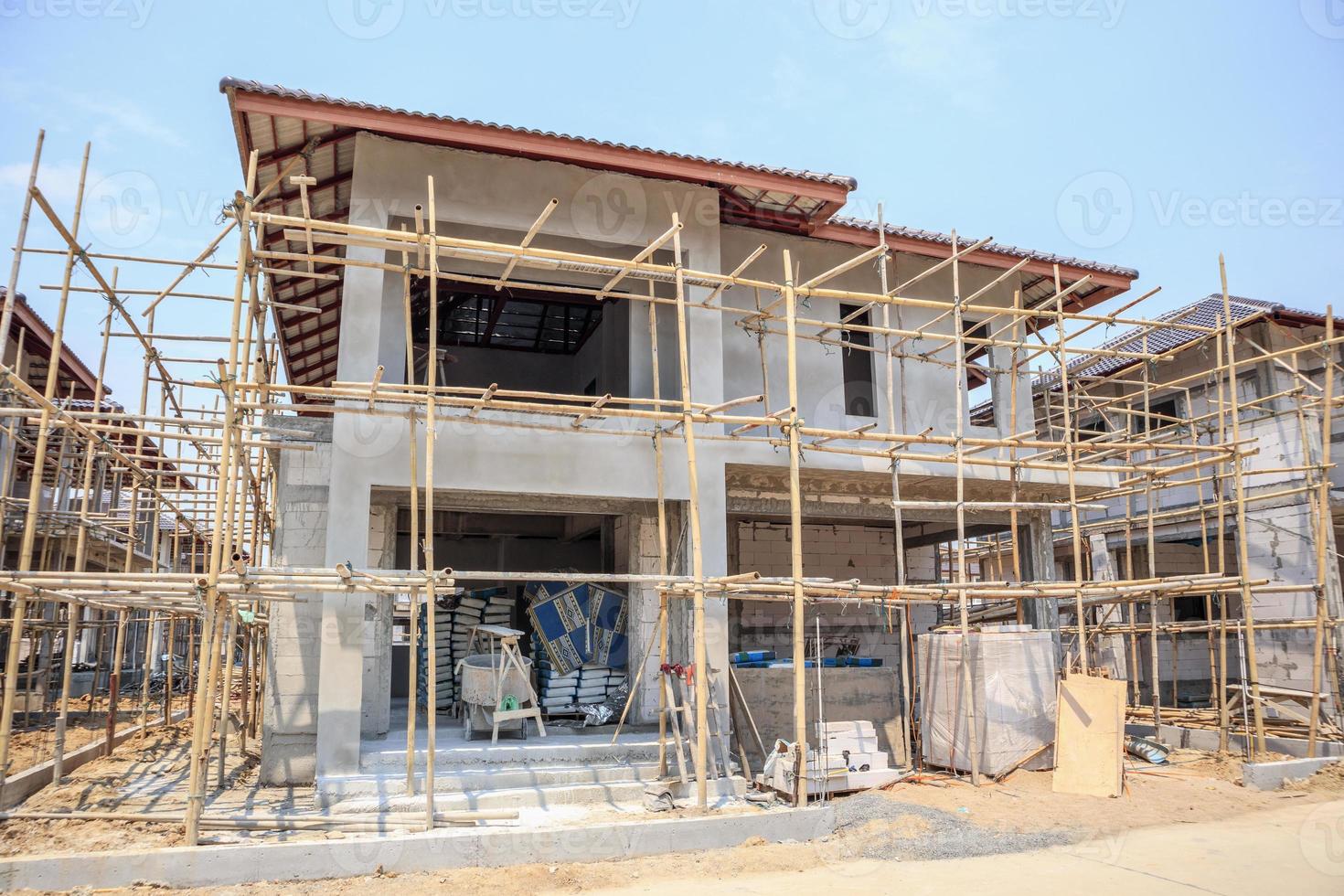 house under construction with autoclaved aerated concrete block structure at building site photo