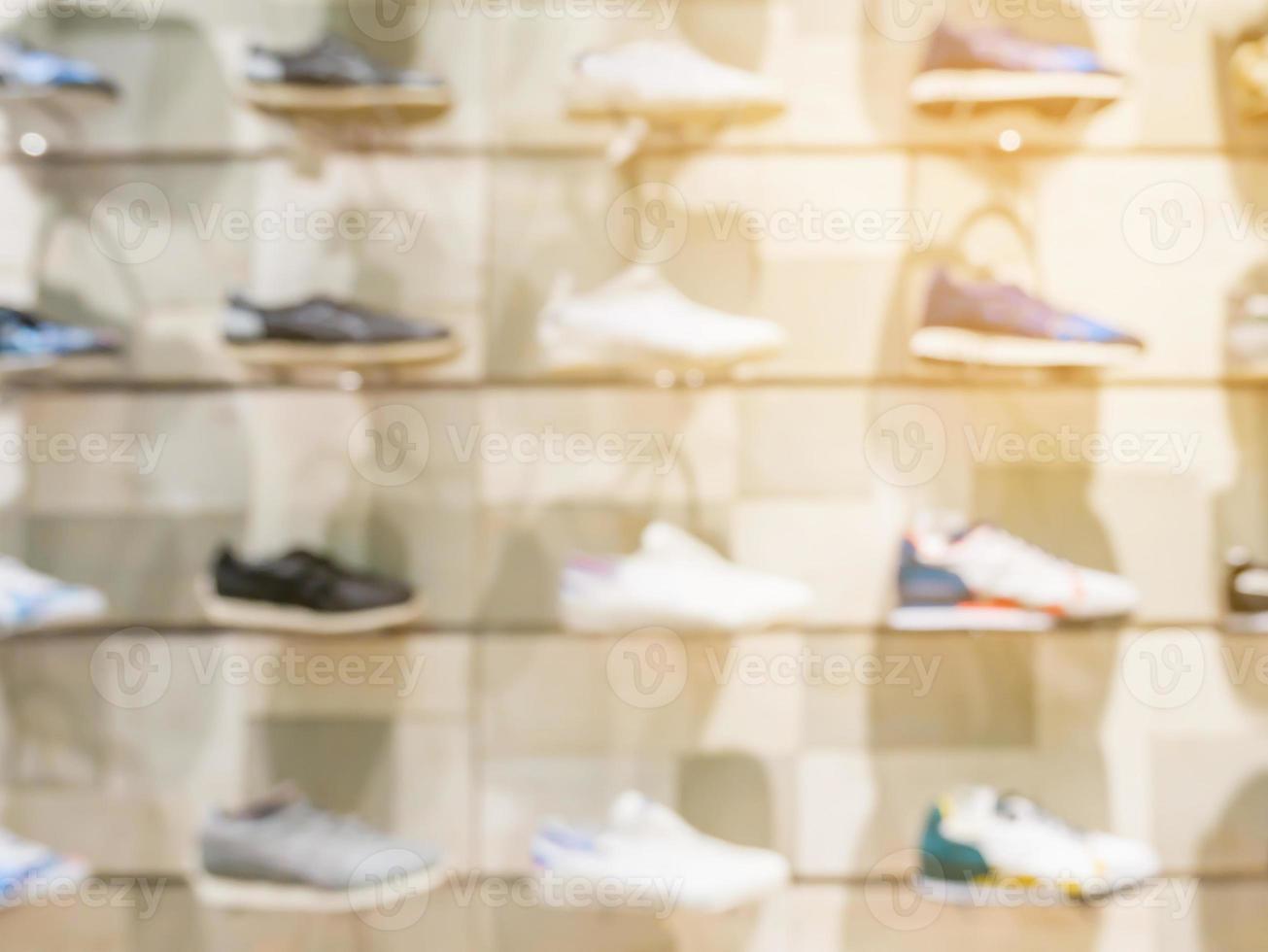 Shoes on shelves in shoes store photo