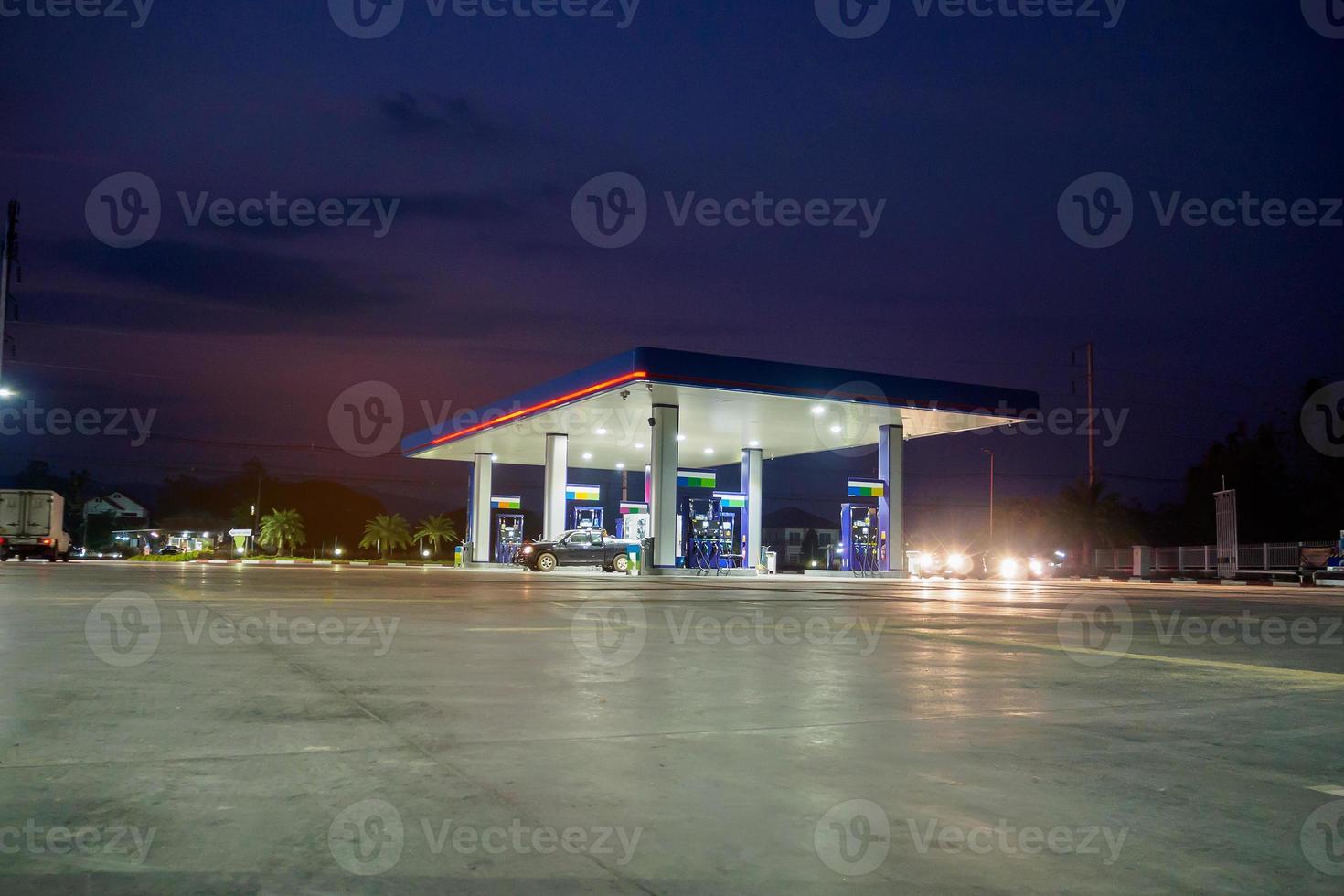 gas station with clouds and sky at sunset photo