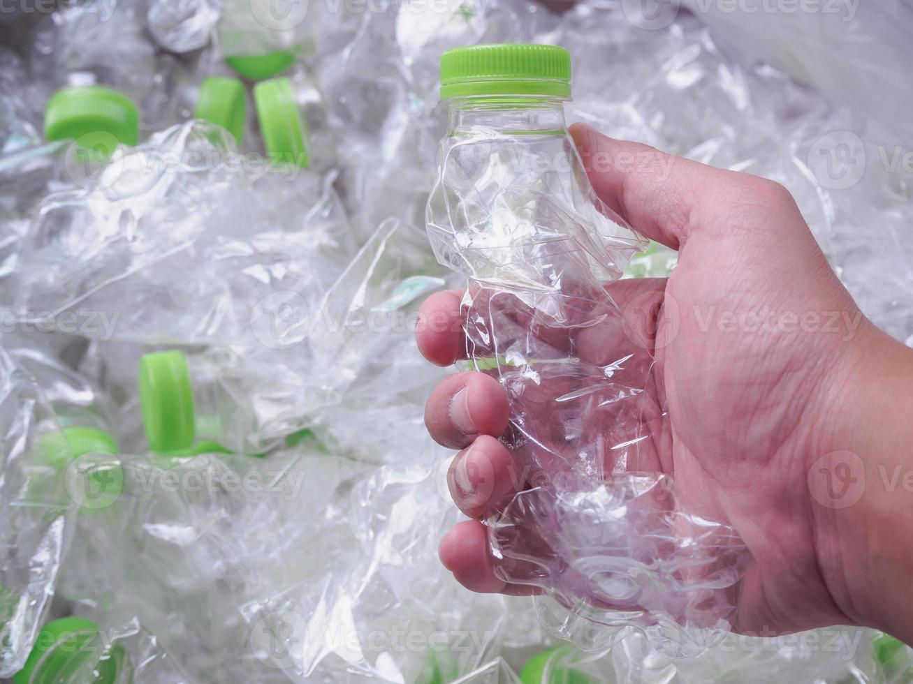 man hand hold plastic bottles, recycle and safe the world from global warming concept photo