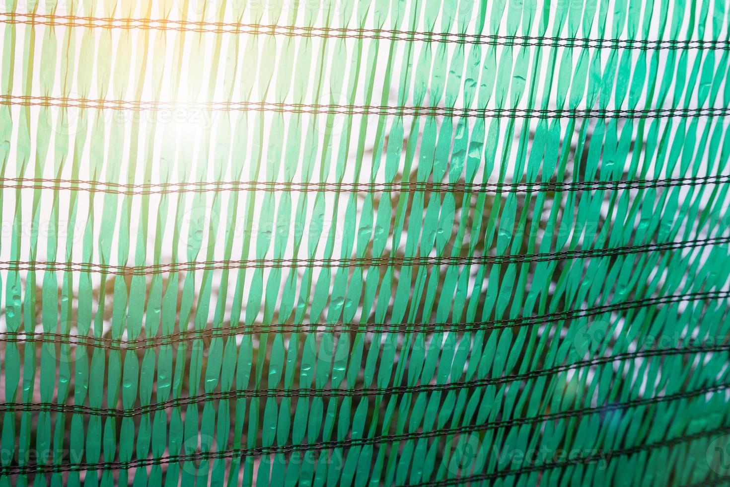 Green Shading Net for protect sun light with tree leaves shadow photo