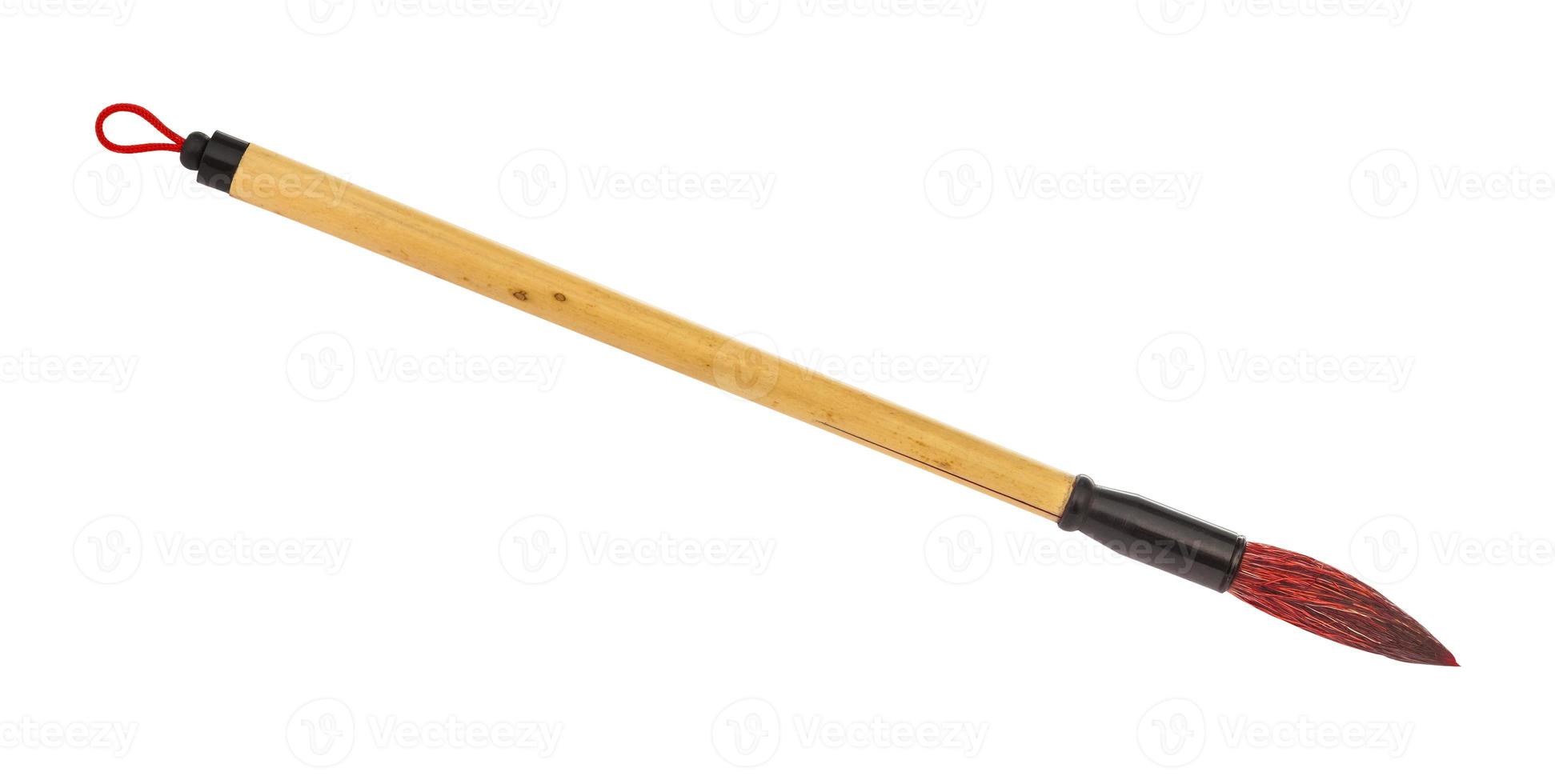 bamboo paint brush with red colored tip isolated photo