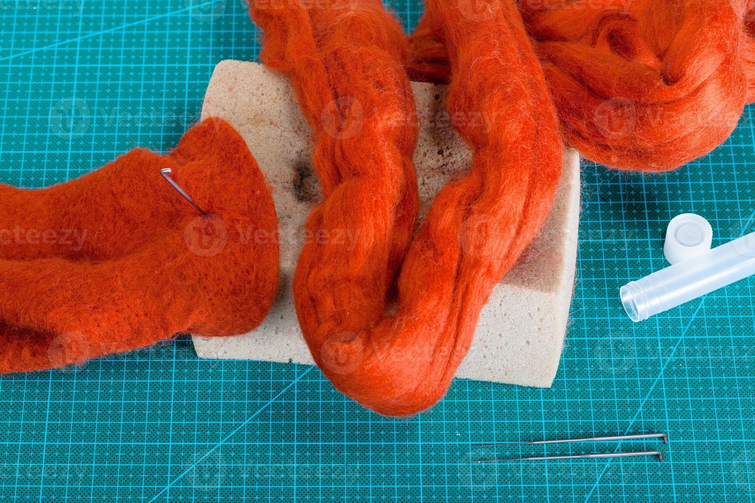 above view of material and tools for felt on mat photo