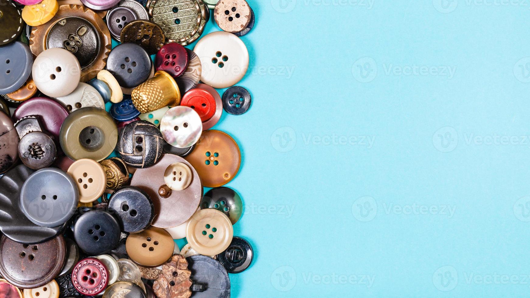 many of various buttons on blue with copyspace photo