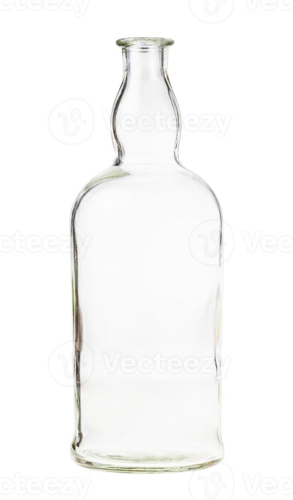 empty clear brandy bottle isolated on white photo