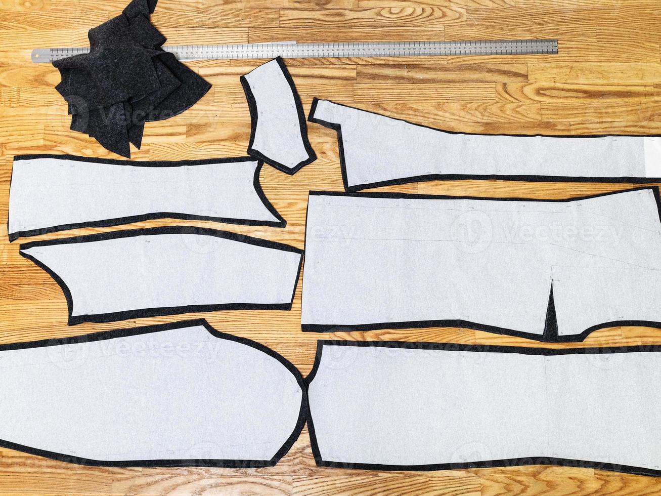 cut dress details with paper layouts on table photo