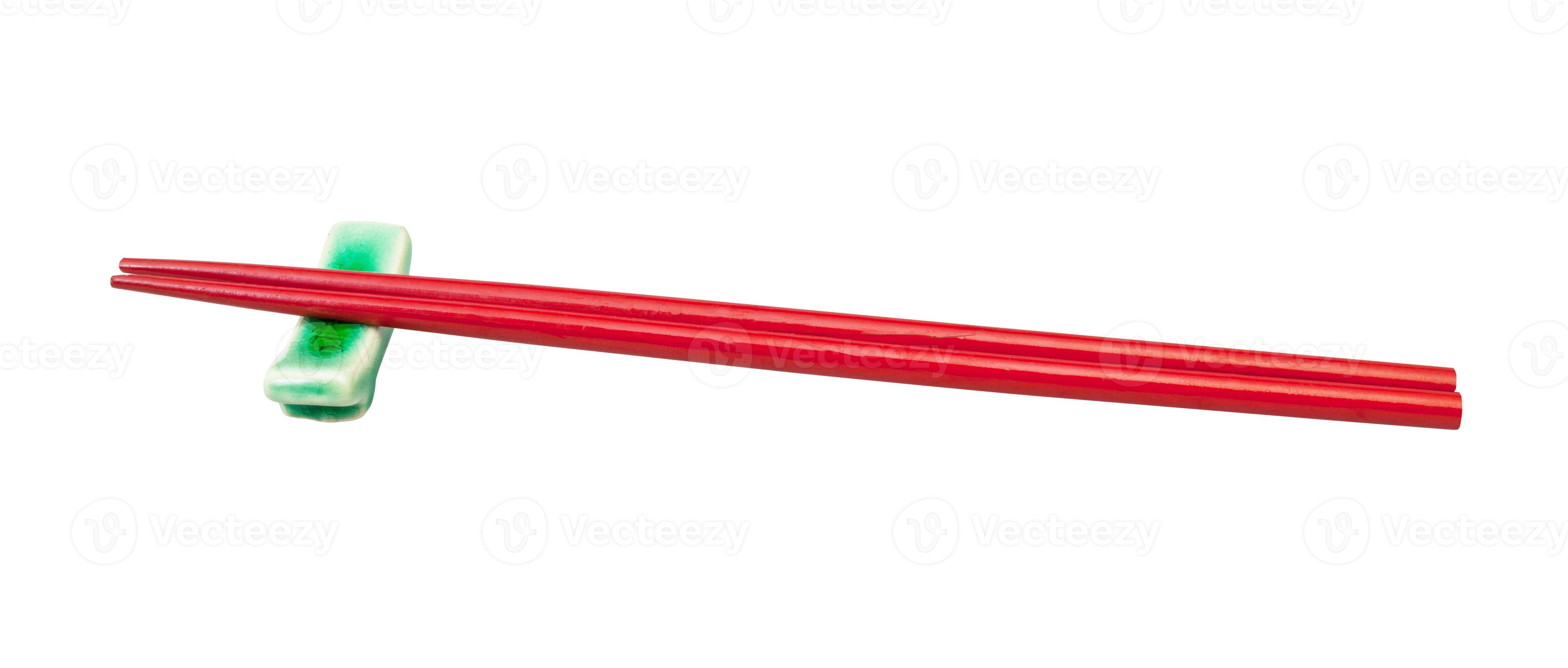 side view of red chopsticks on chopstick rest 11184802 Stock Photo at