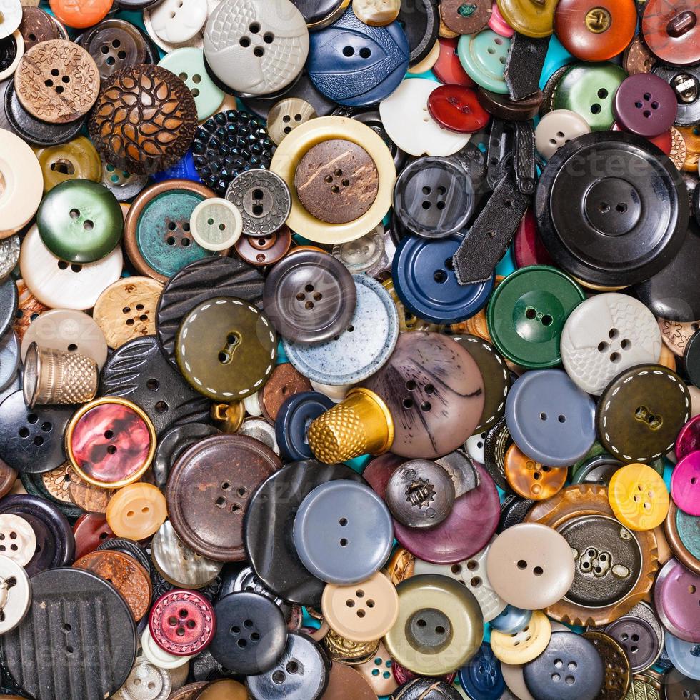 heap of many various buttons close up on blue photo