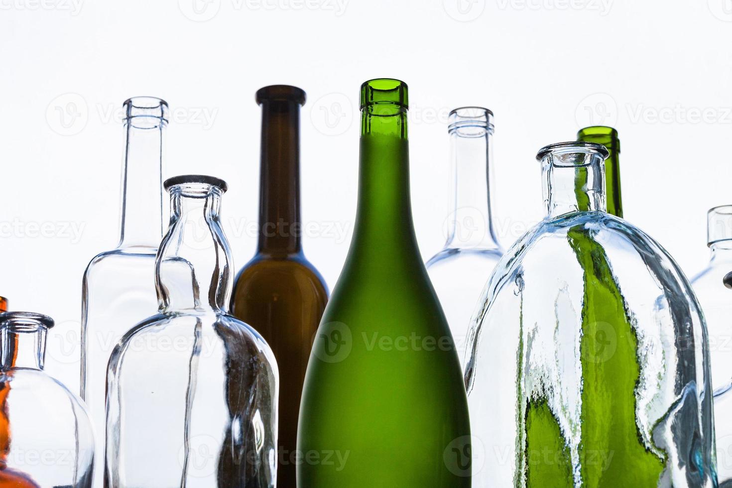 various empty bottles and view of gray sky photo