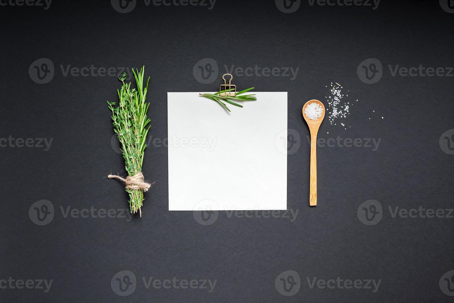 Blank notepad page with greens herbs and spices photo