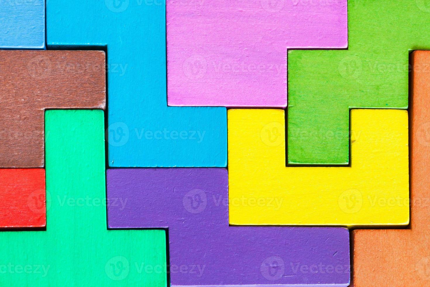 surface of assembled puzzle from wood pentominoes photo