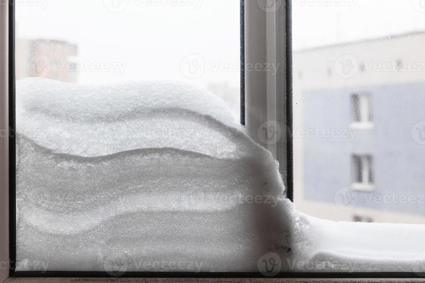 snowdrift between window glasses at home photo