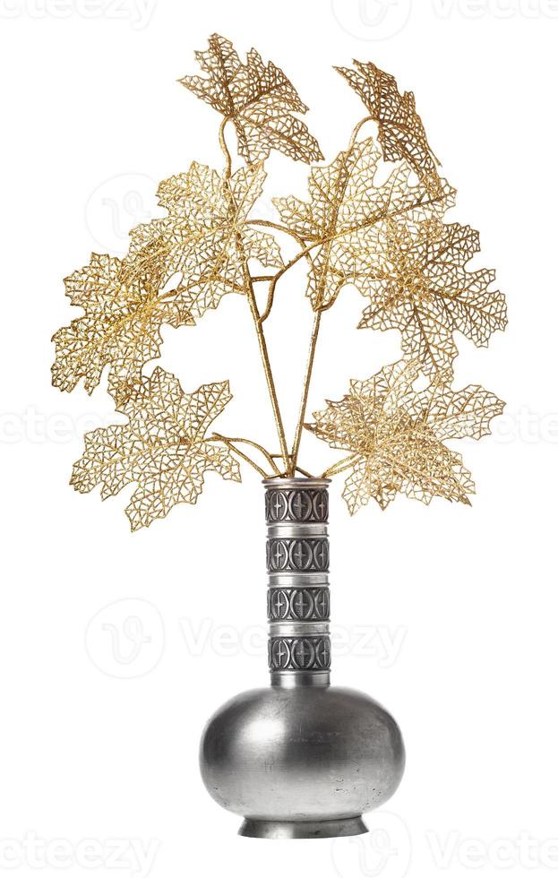 plastic twigs of tree in pewter jug isolated photo