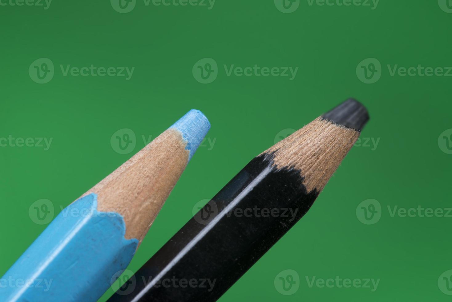 tip detail of color pencils on a green background photo