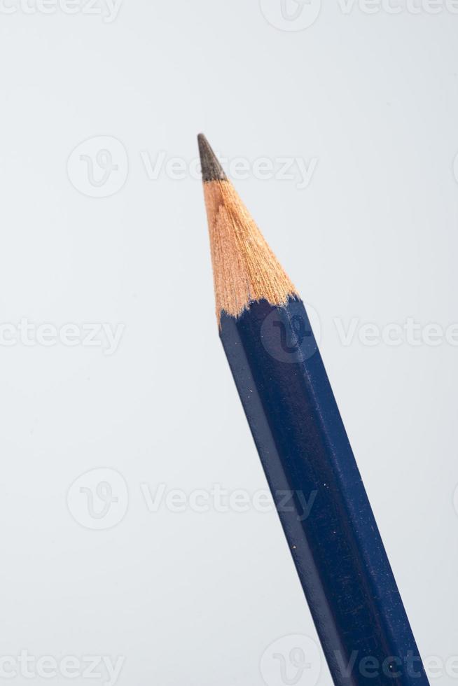 tip detail of black pencils on a little blue background photo