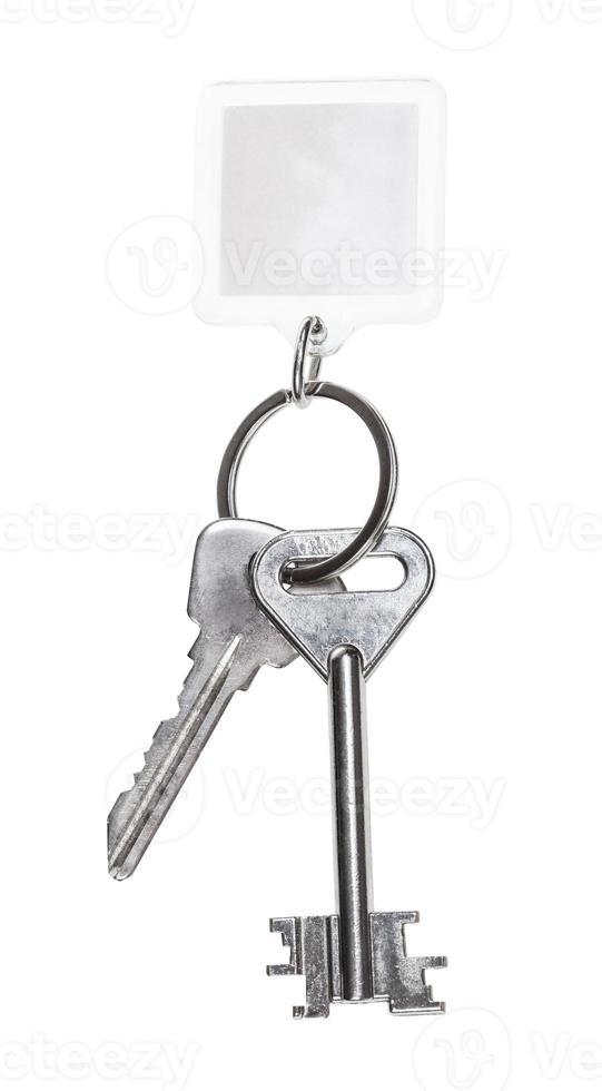 steel keys on keyring with blank keychain isolated photo