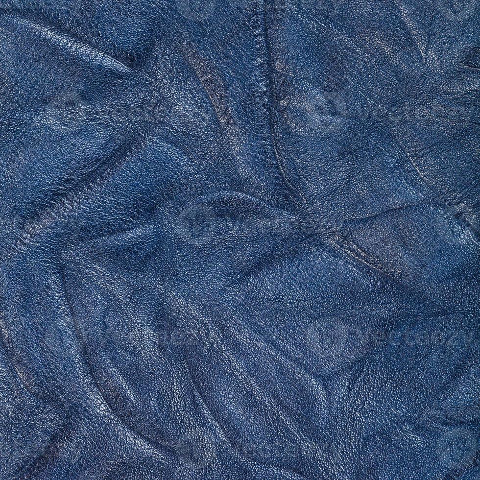 background from blue crumpled leather close up photo