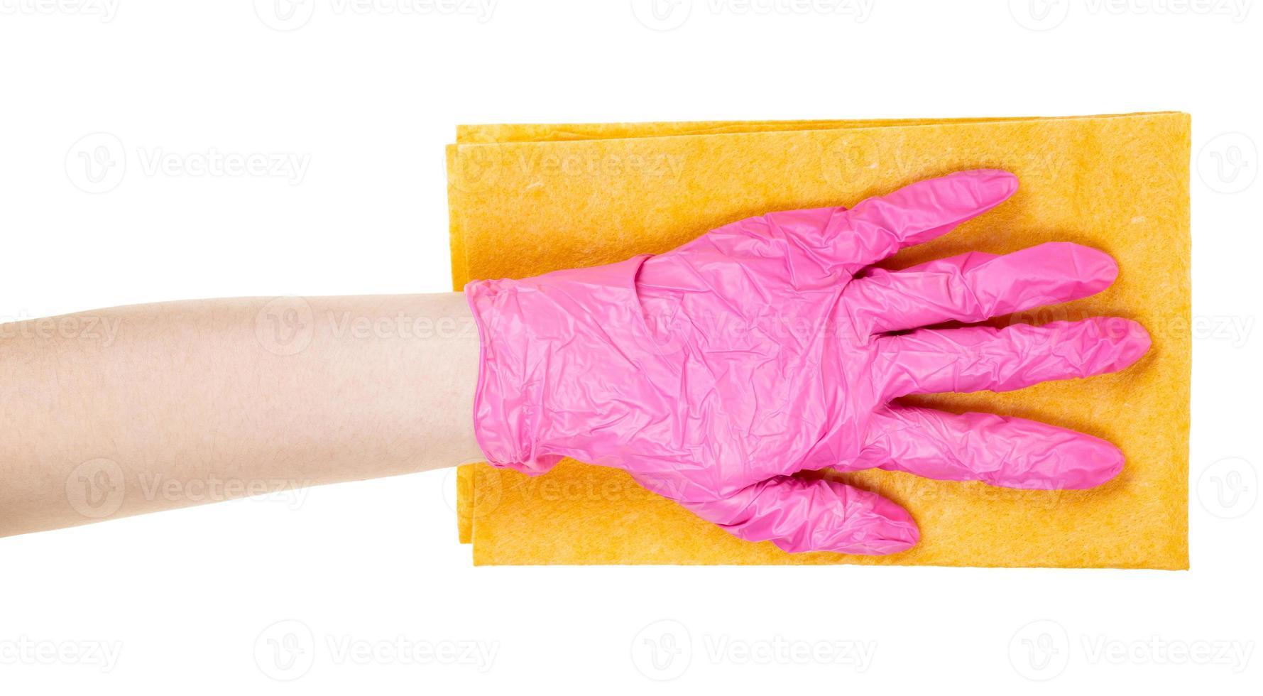 hand in pink glove holds flat yellow rag isolated photo