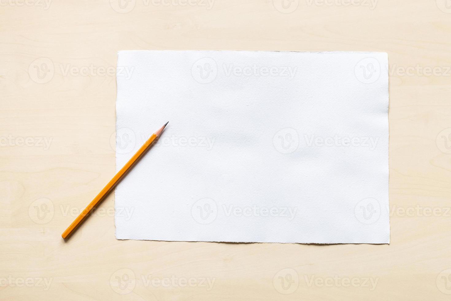 regular pencil on blank sheet of white paper photo