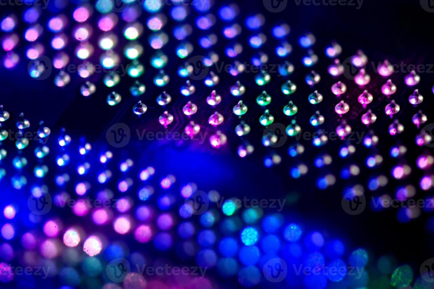 Abstract background with neon light on computer processing equipment photo