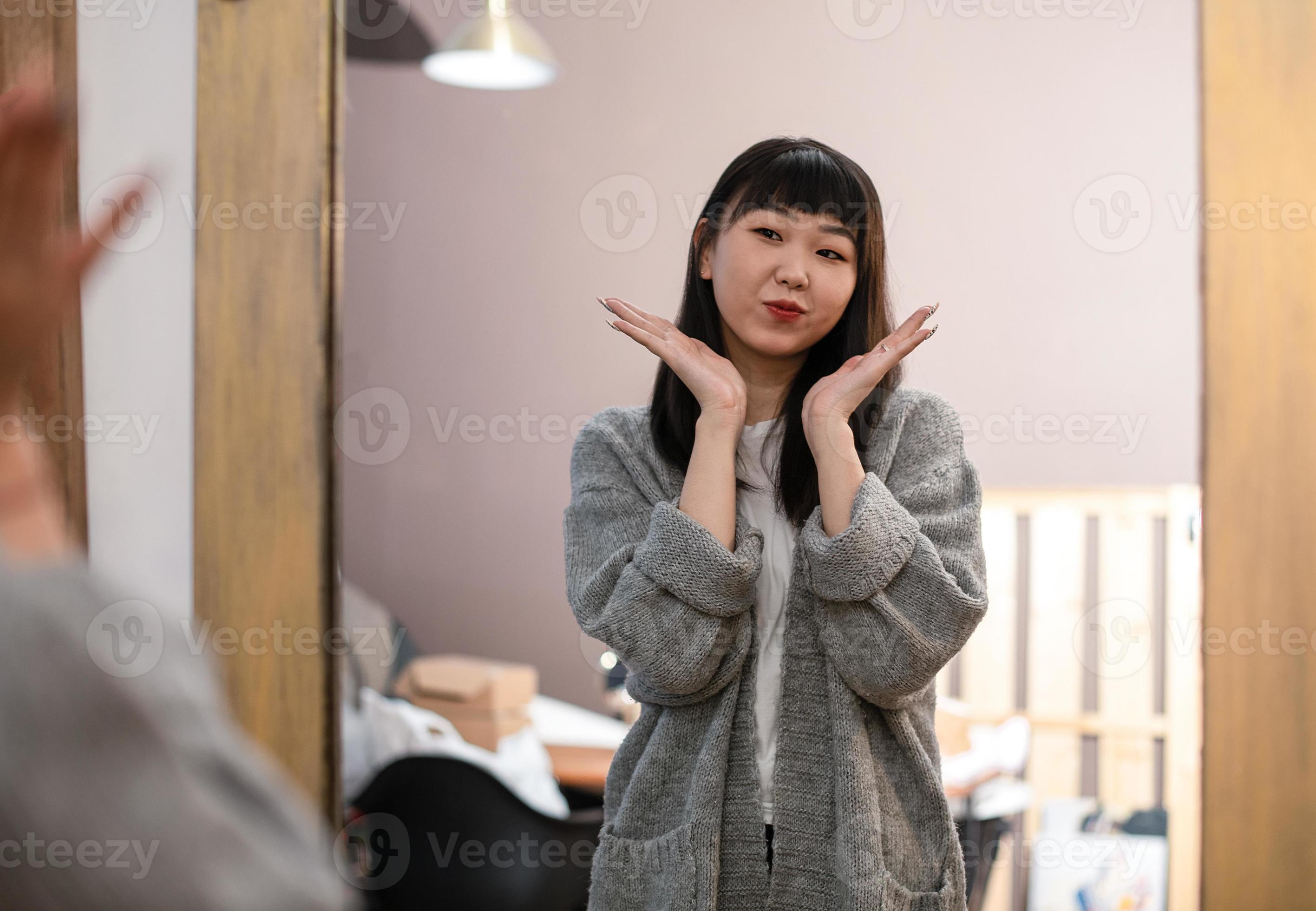 Cute Asian Korean girl chooses clothes, takes care of herself and poses funny in front of the mirror in the living room. 11193495 Stock Photo at Vecteezy Cute Asian Korean girl chooses clothes, takes care of herself and poses funny in front of the mirror in the living room. 11193495 Stock Photo at Vecteezy