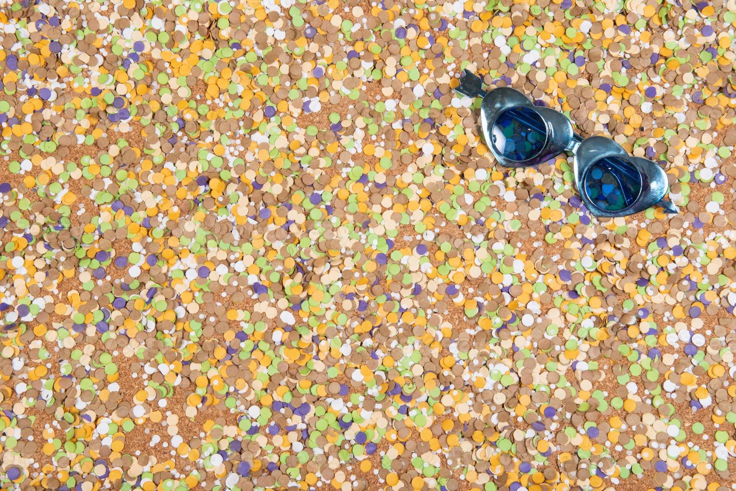 Background of confetti with elements related to the carnival and summer photo
