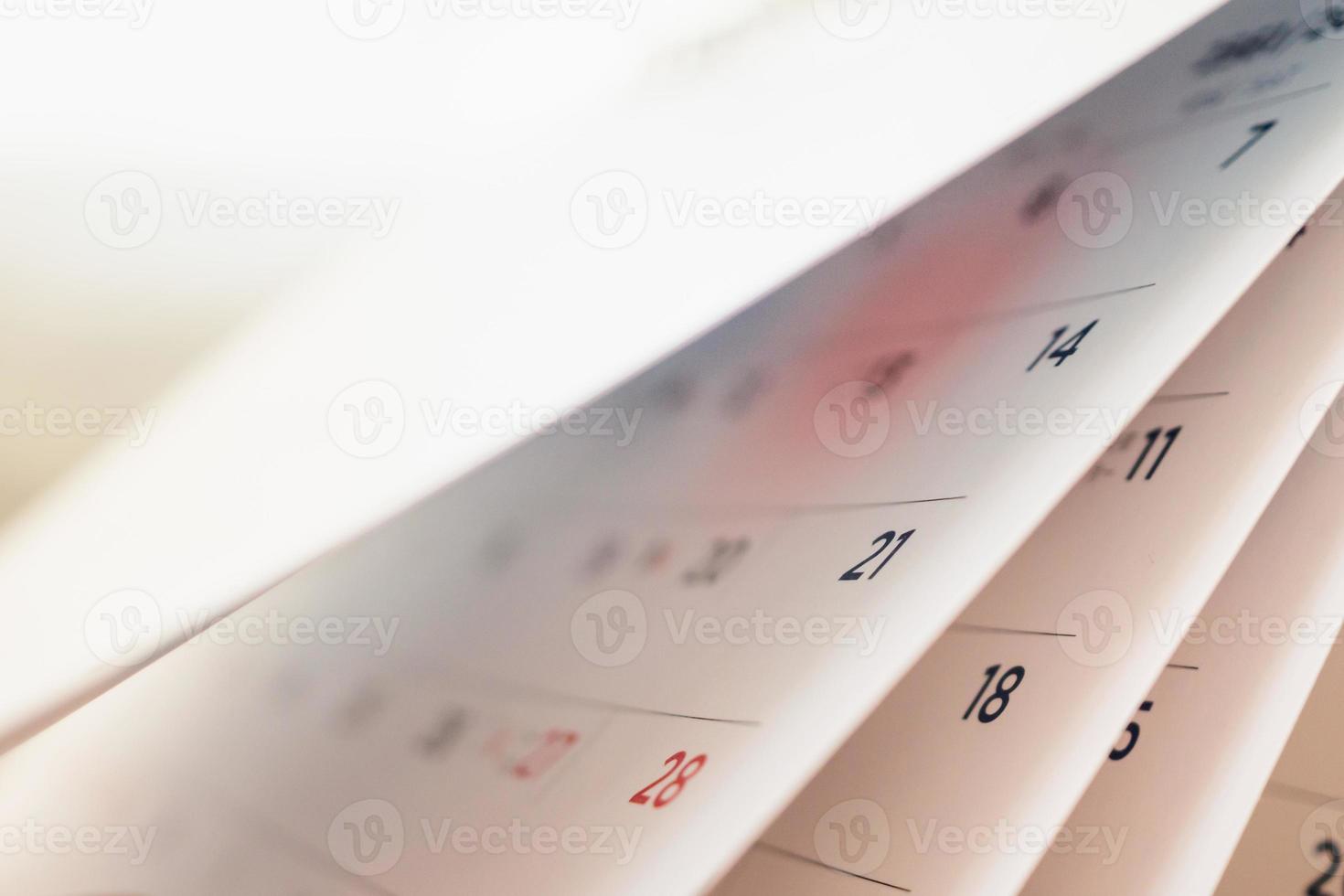 Abstract blur calendar page flipping sheet close up background photo