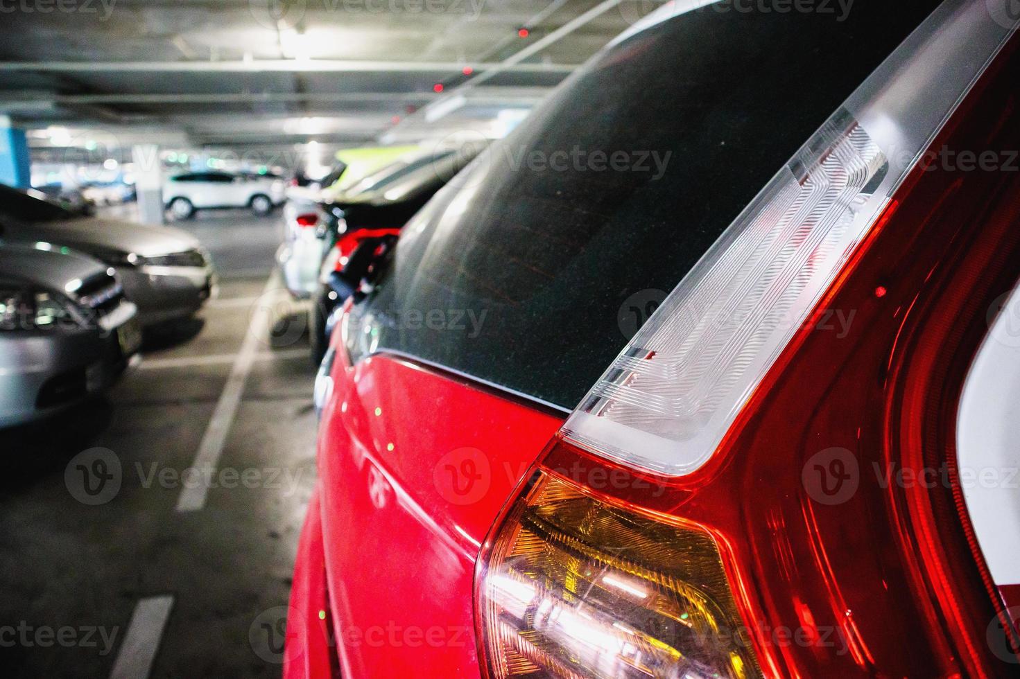 cars in parking garage interior photo