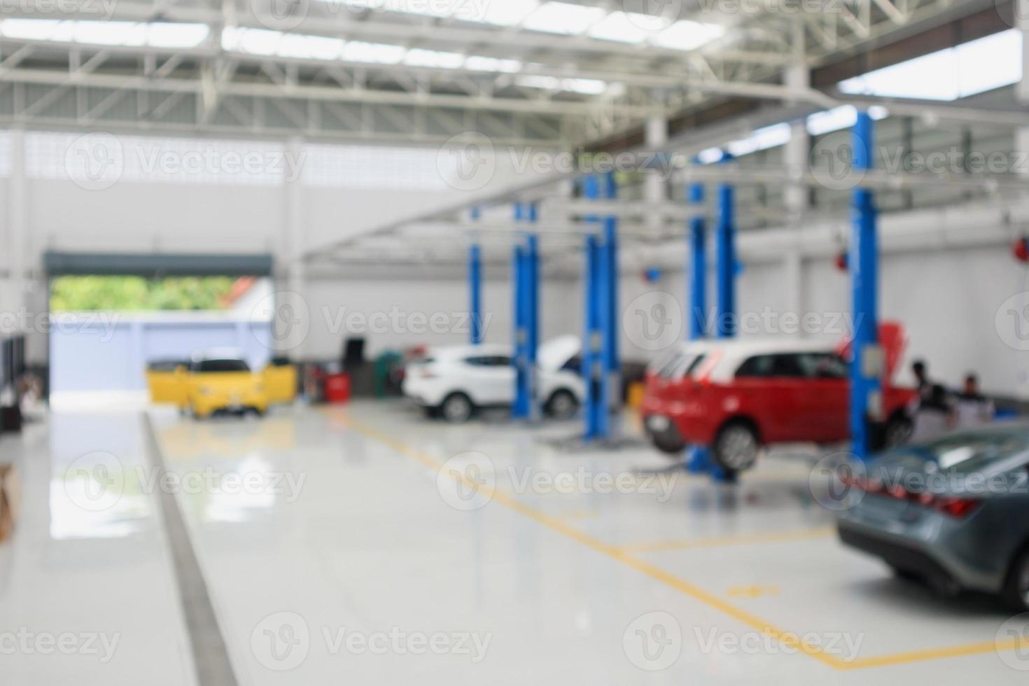 car service centre with auto at repair station bokeh light defocused blur background photo