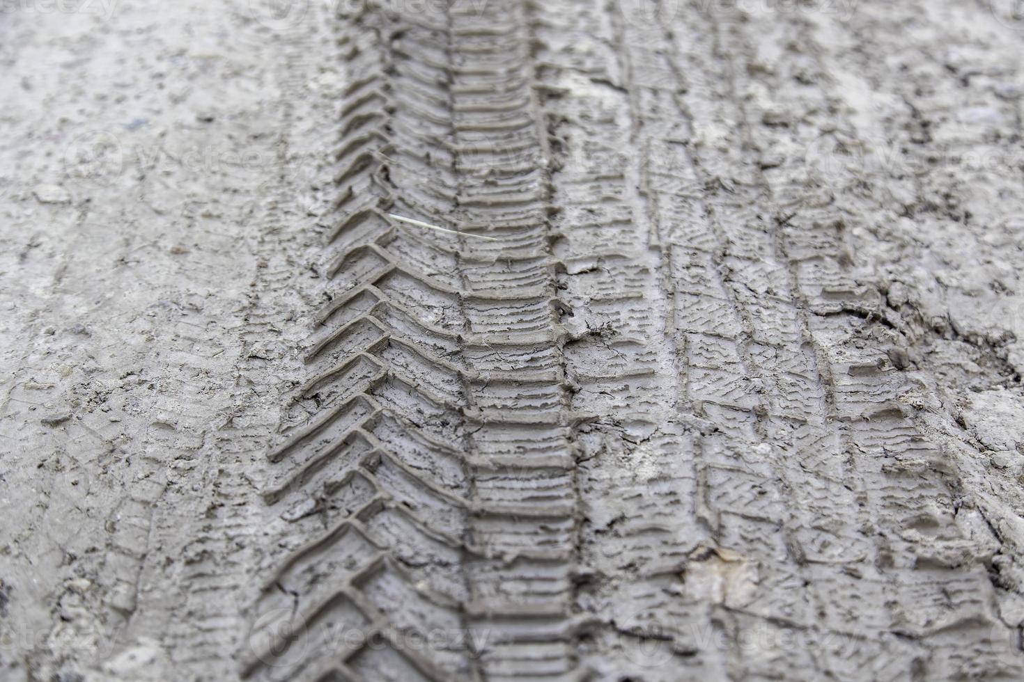 Wheel marks in the mud photo