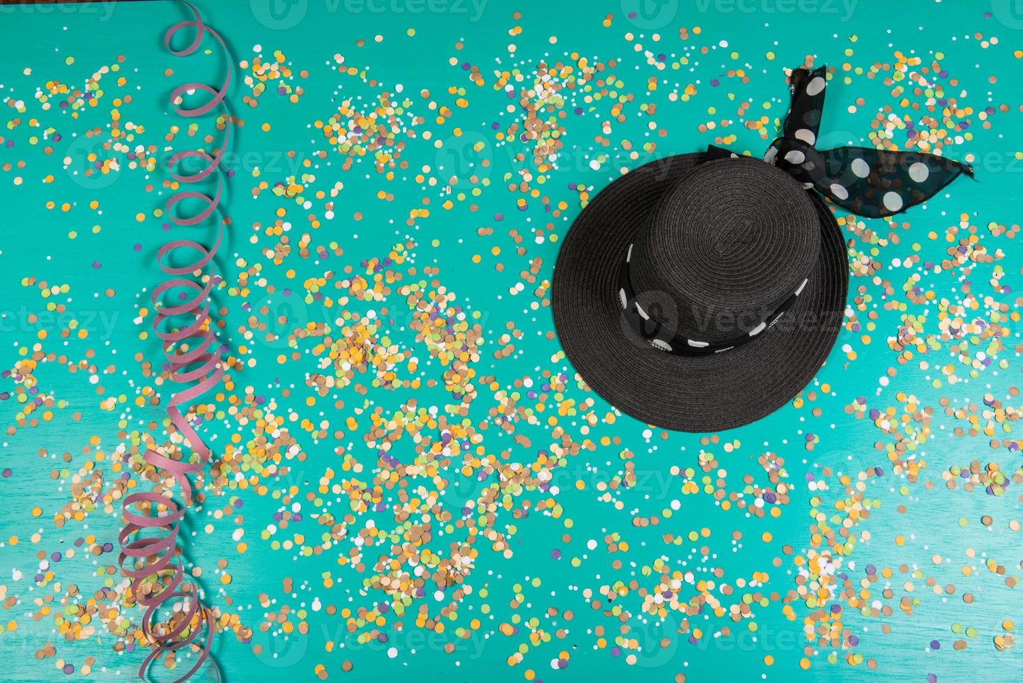 Background of confetti with elements related to the carnival and summer photo