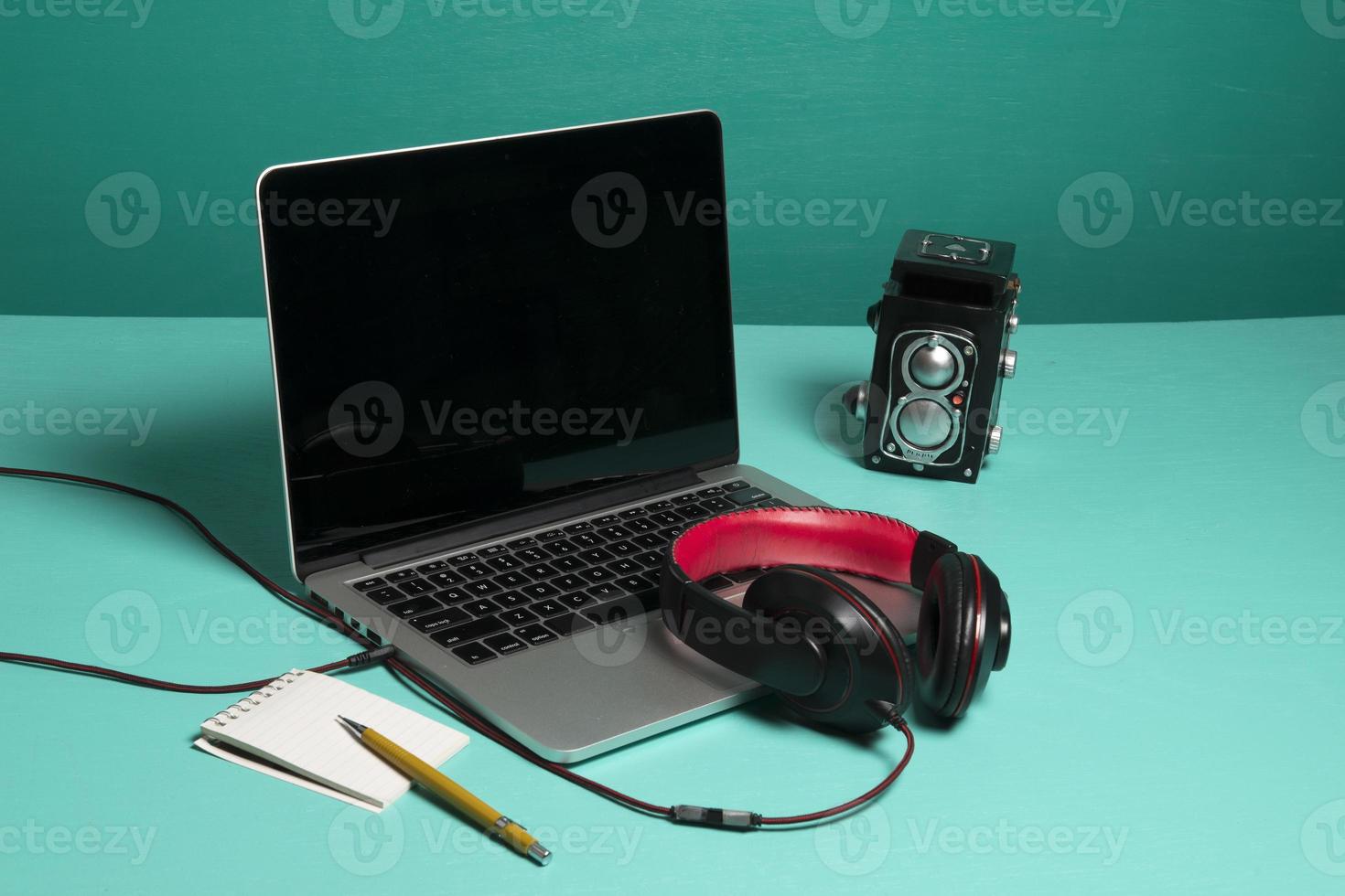 Red earphone on a notebook photo