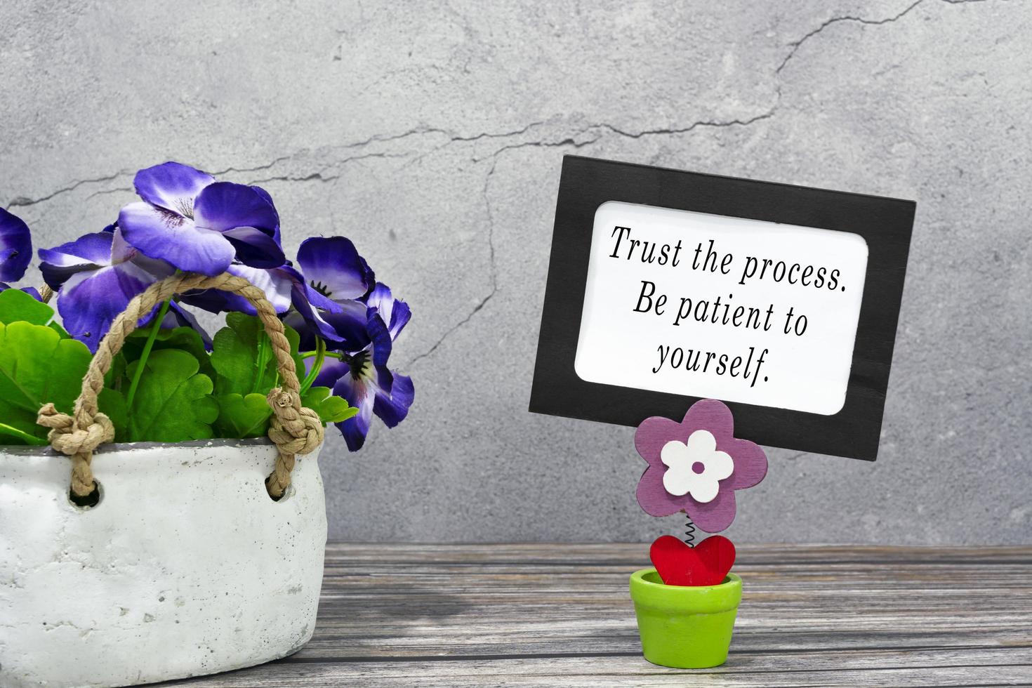 Inspirational quote on a paper frame - Trust the process. Be patient to yourself photo
