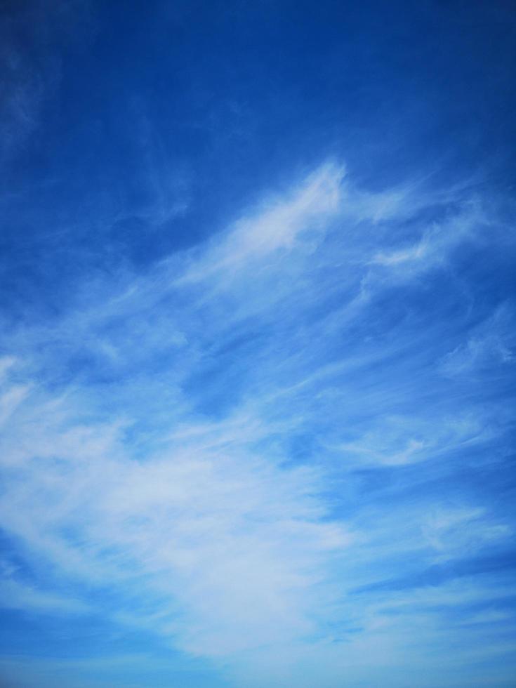 Cirrus clouds on a blue sky background photo