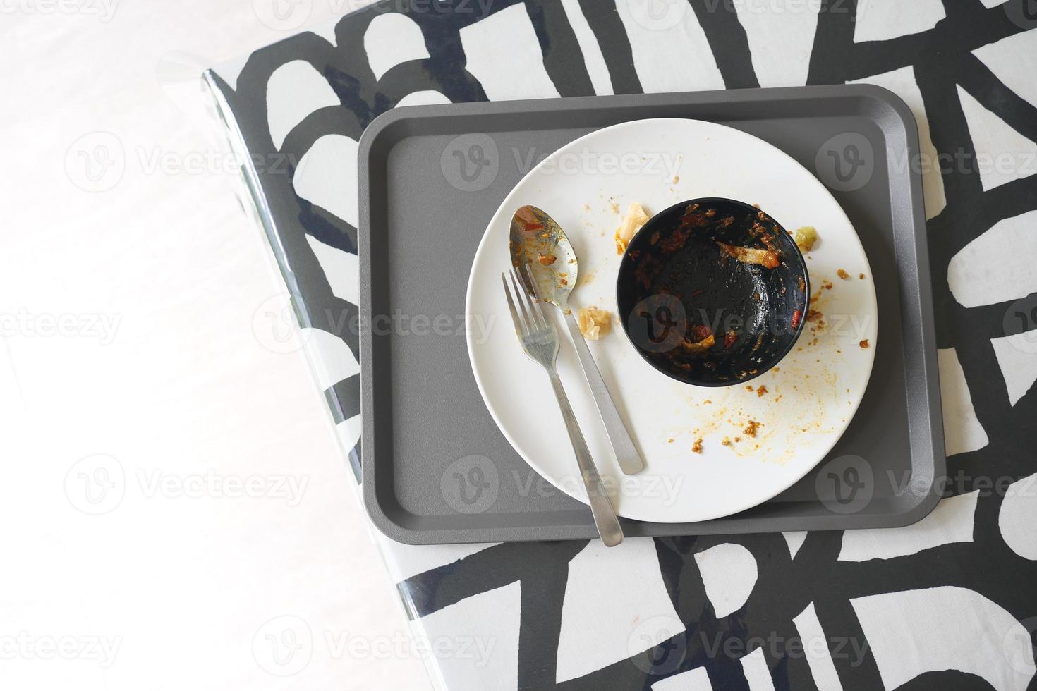 Empty plate after eating on table photo