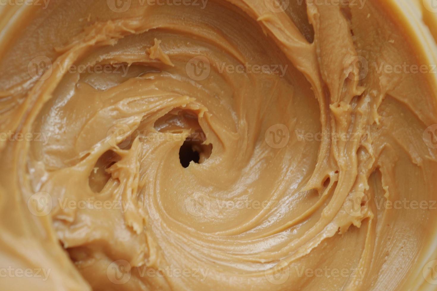 top view of peanut butter in a container , photo