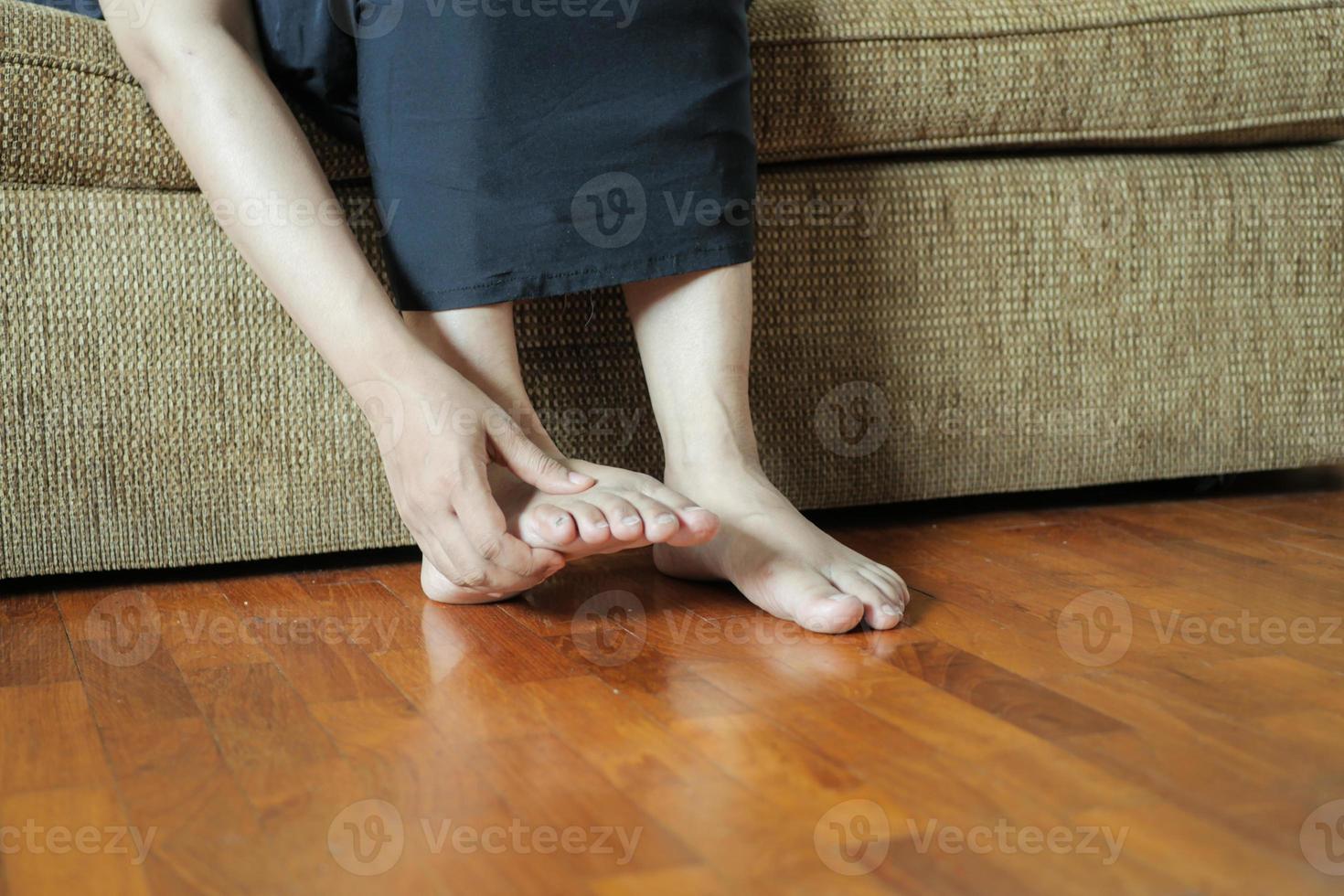 Close up on women feet and hand massage on injury spot. photo