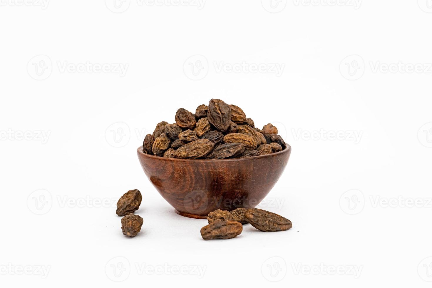 Organic Badi Harad fruit or Terminalia chebulaon white background photo