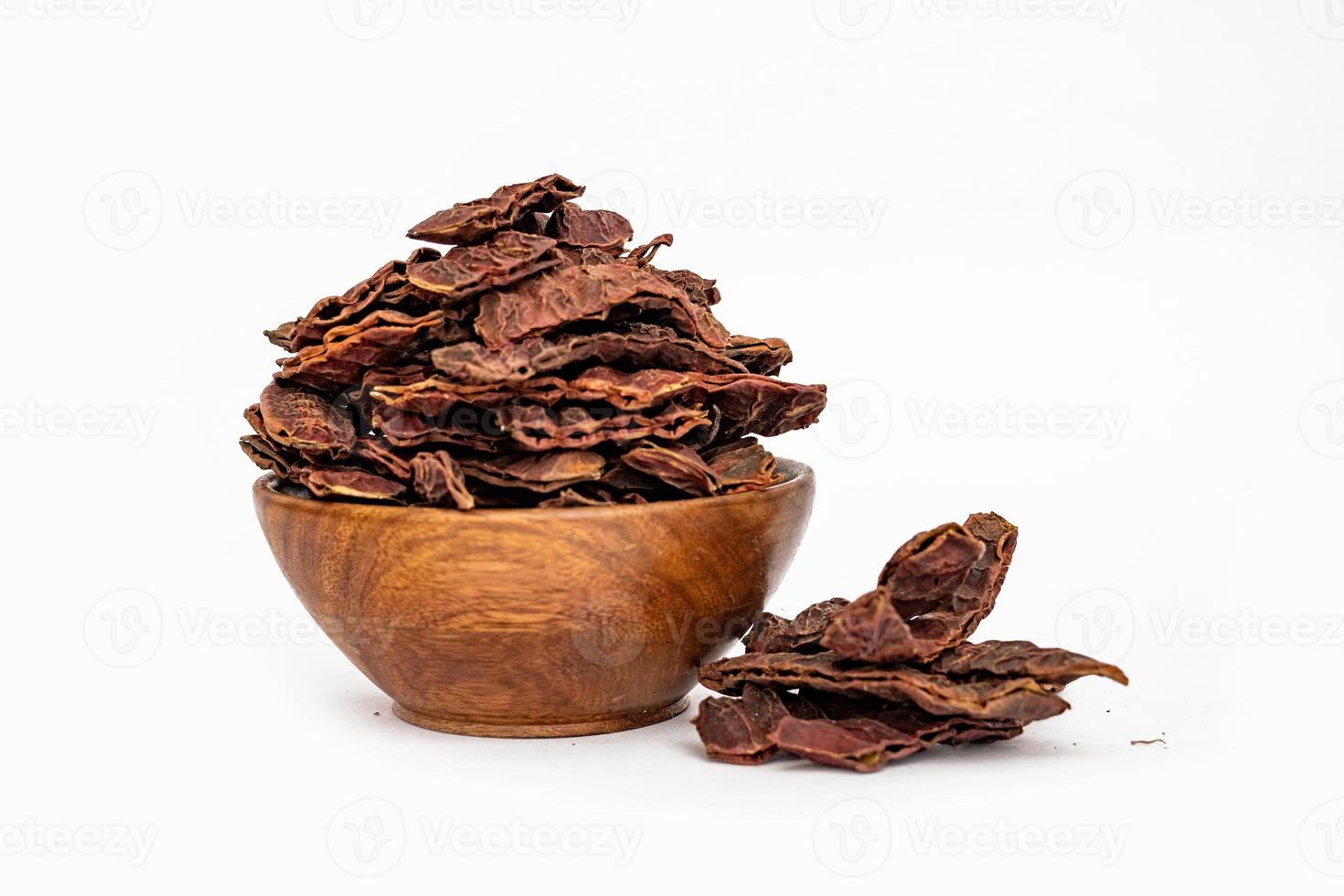 Acacia concinna Soap Bobs or Dried shikakai pods isolated on white background photo