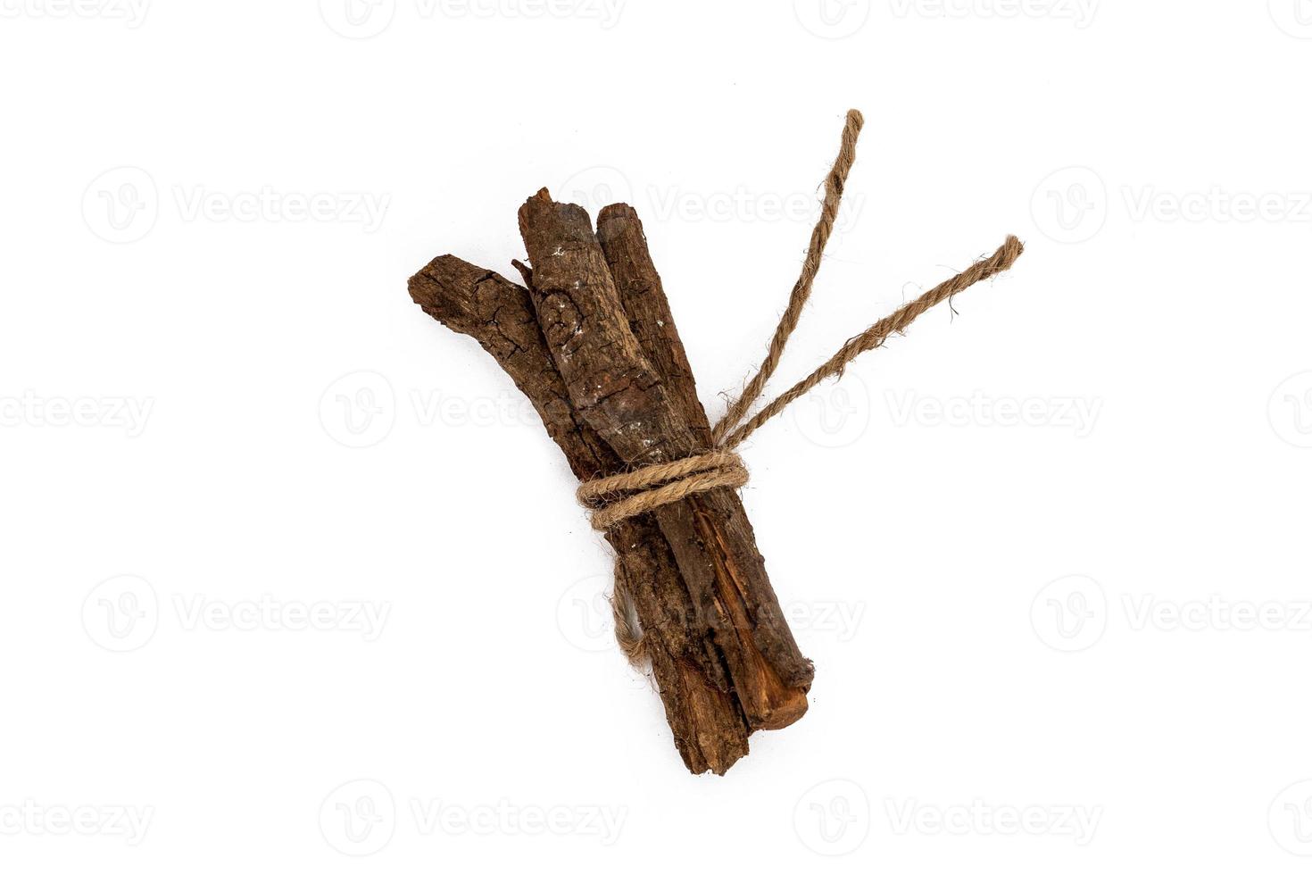 Set with dried sticks of mulethi or Glycyrrhiza glabra root on white background photo