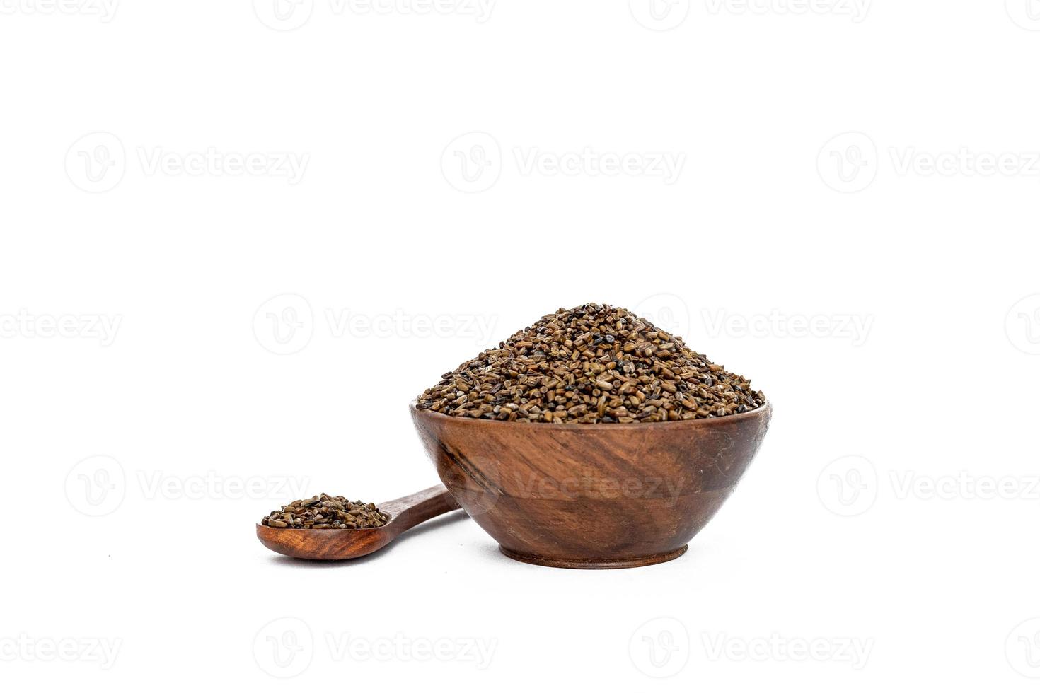 Indigofera or indigo seeds in wooden bowl photo
