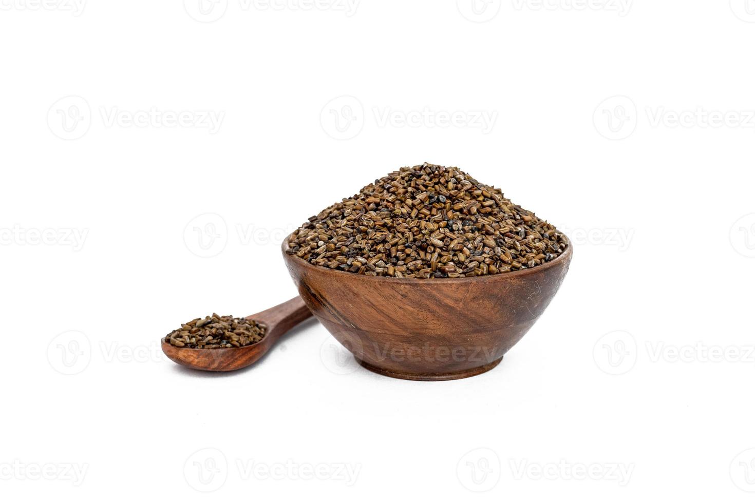 Indigofera or indigo seeds in wooden bowl photo