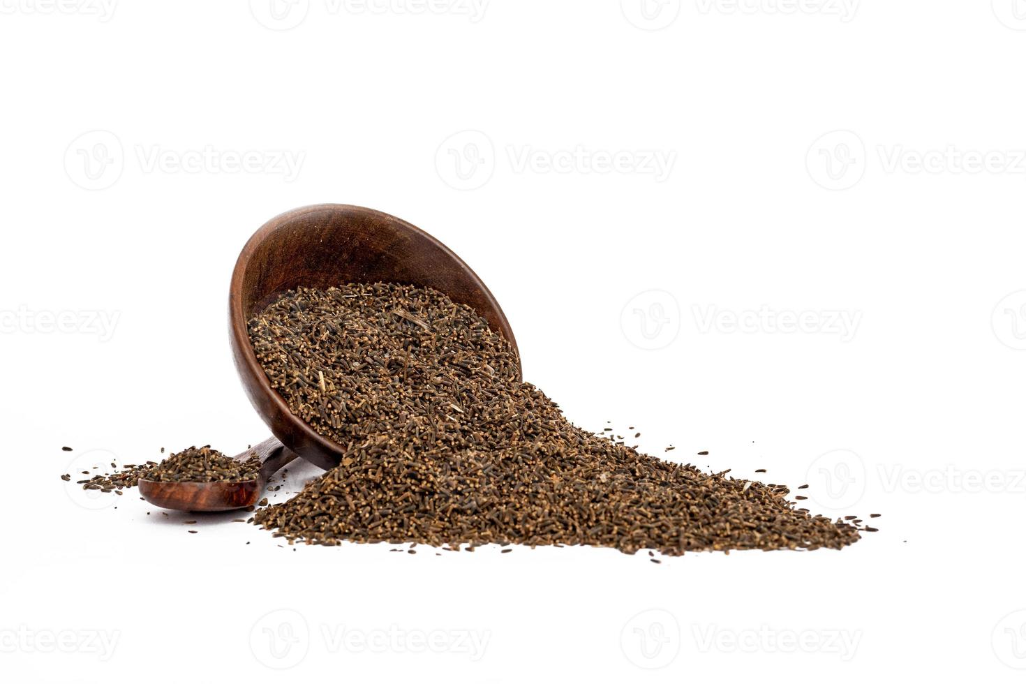 Indigofera or indigo seeds in wooden bowl photo