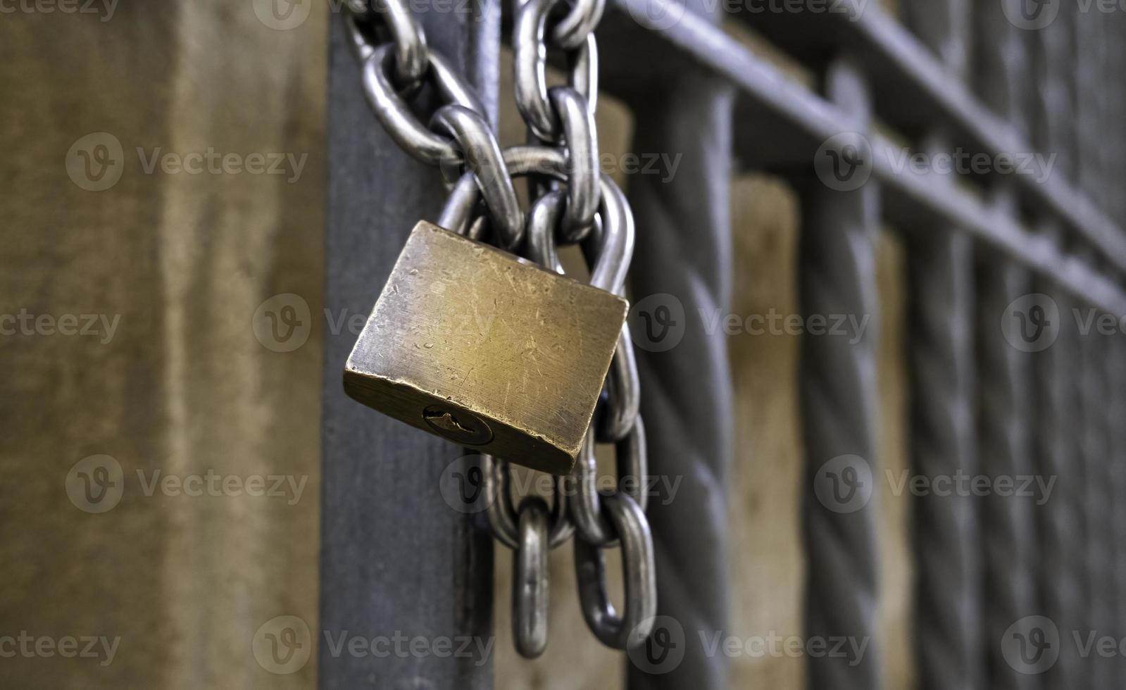 Padlock on a fence photo